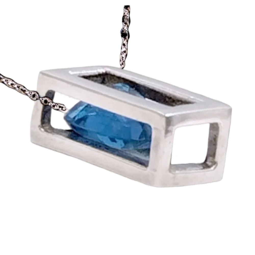 Sterling Silver Open Frame Pendant with Floating Blue Topaz on Stainless Chain